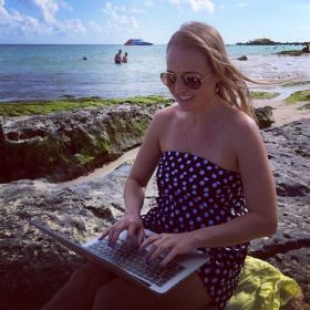 Kristin Wilson working with the ocean at her back in Mexico – Best Places In The World To Retire – International Living